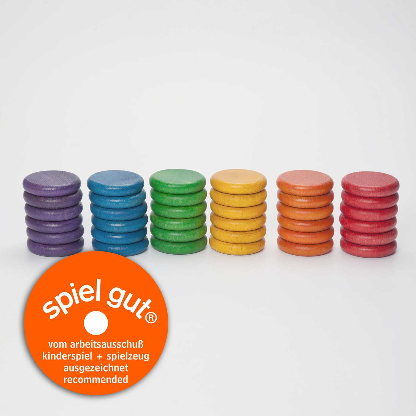 A stack of 36 wooden coins, 6 in each stack, one of each color of the rainbow.